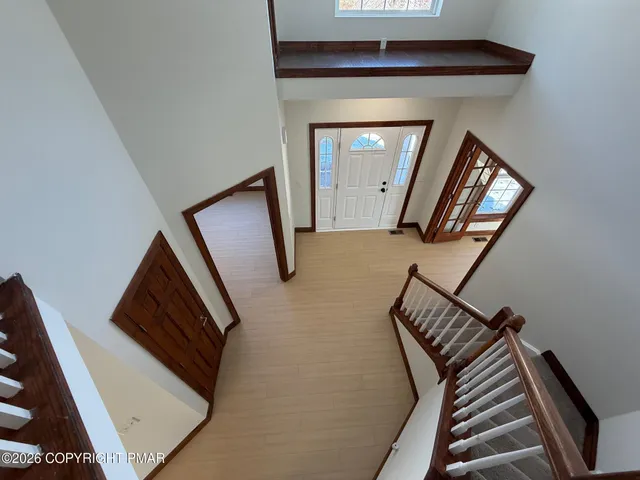 a view of staircase with wooden floor and stairs
