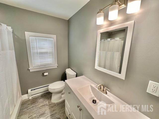 15 Doughty Street, Unit C Raritan, NJ 08869 - Photo 11 of 18 a bathroom with a sink a toilet and a mirror