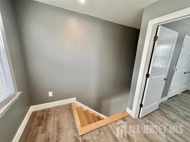15 Doughty Street, Unit C Raritan, NJ 08869 - Photo 13 of 18 a view of a room with wooden floor and a window