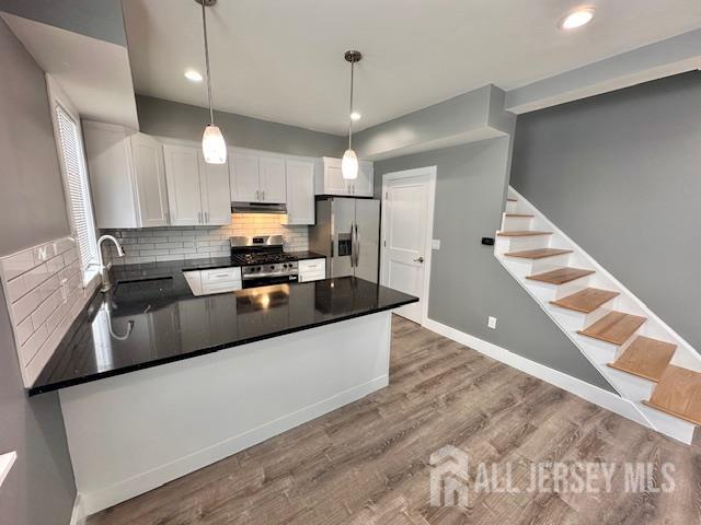 15 Doughty Street, Unit C Raritan, NJ 08869 - Photo 6 of 18 a large kitchen with granite countertop a large counter top appliances and cabinets