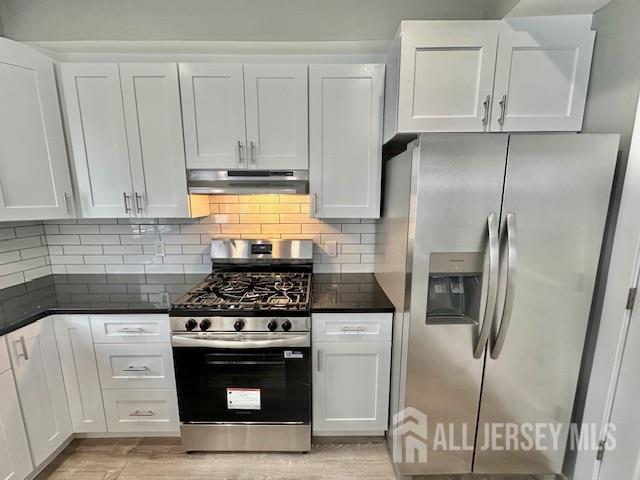 15 Doughty Street, Unit C Raritan, NJ 08869 - Photo 7 of 18 a kitchen with stainless steel appliances granite countertop a stove a refrigerator and a cabinets