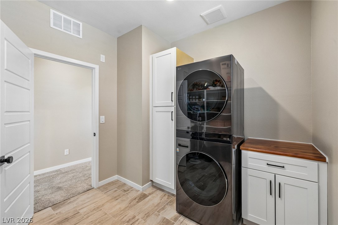 194 Viento Ridge Street Henderson, NV 89012 - Photo 40 of 72 Functional cabinetry and clean flooring maximize utility in this modern utility space.