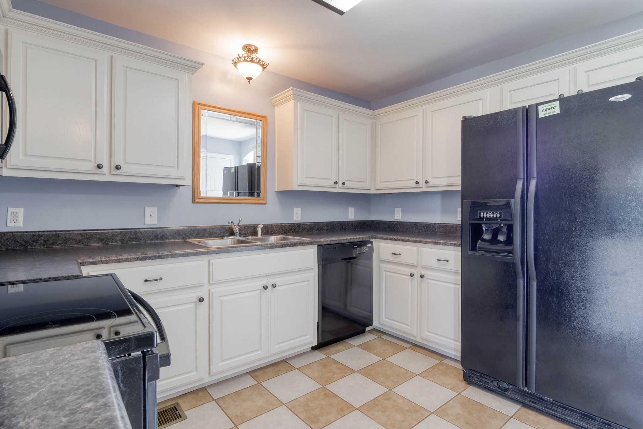 724 Lear Road Portland, TN 37148 - Photo 11 of 32 a kitchen with stainless steel appliances granite countertop a sink stove and refrigerator