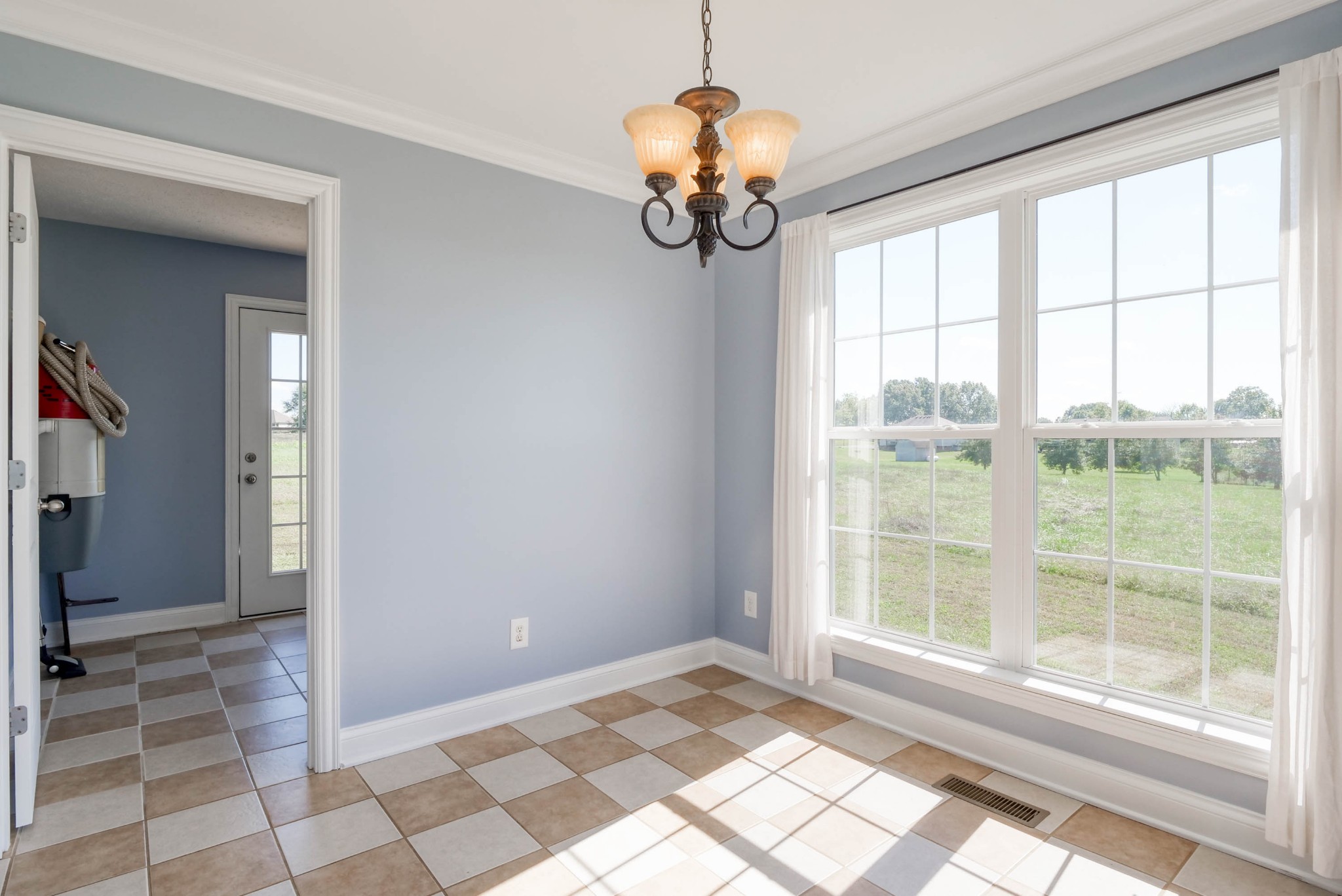 724 Lear Road Portland, TN 37148 - Photo 13 of 32 a view of a bedroom with wooden floor and windows