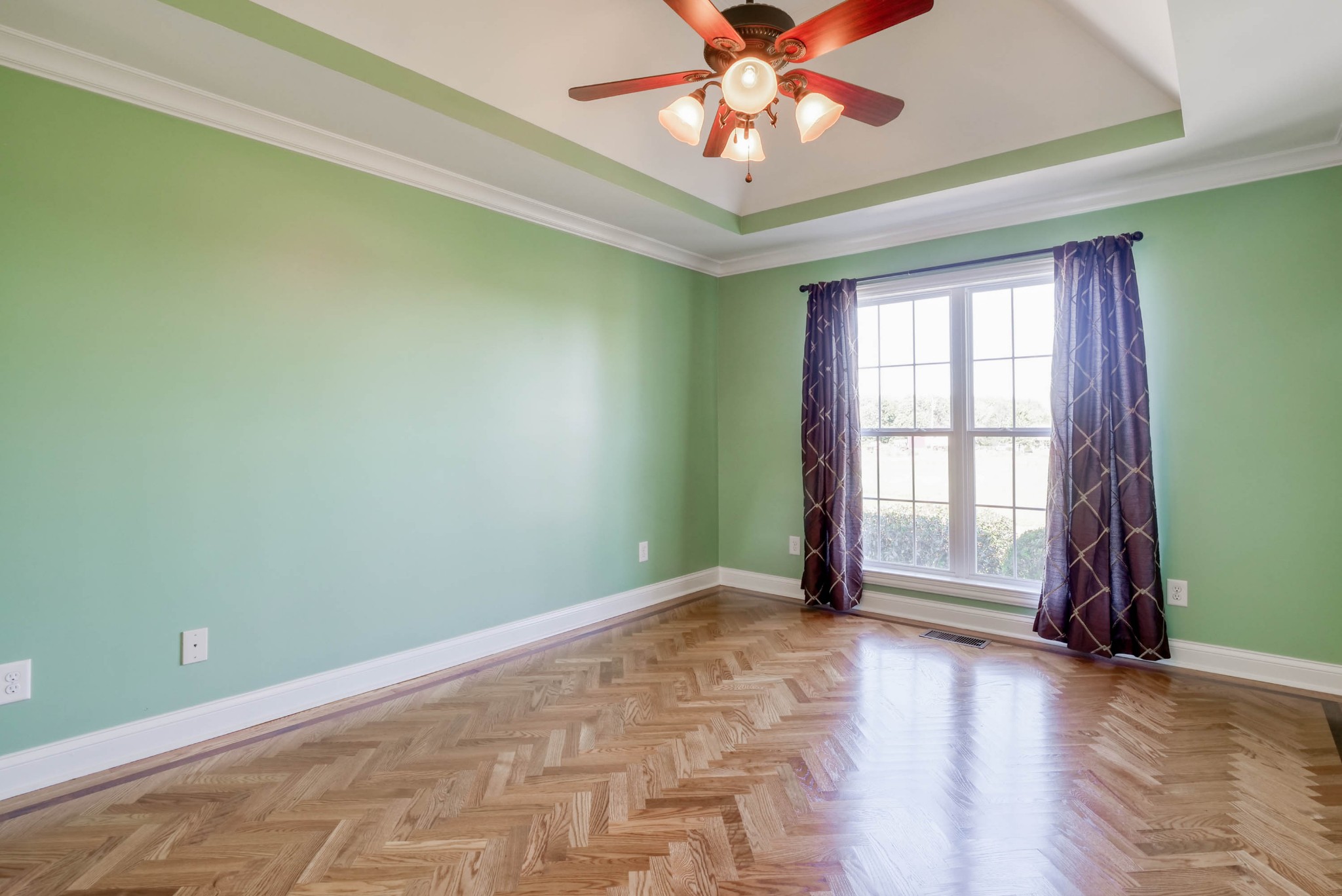 724 Lear Road Portland, TN 37148 - Photo 16 of 32 an empty room with wooden floor and windows