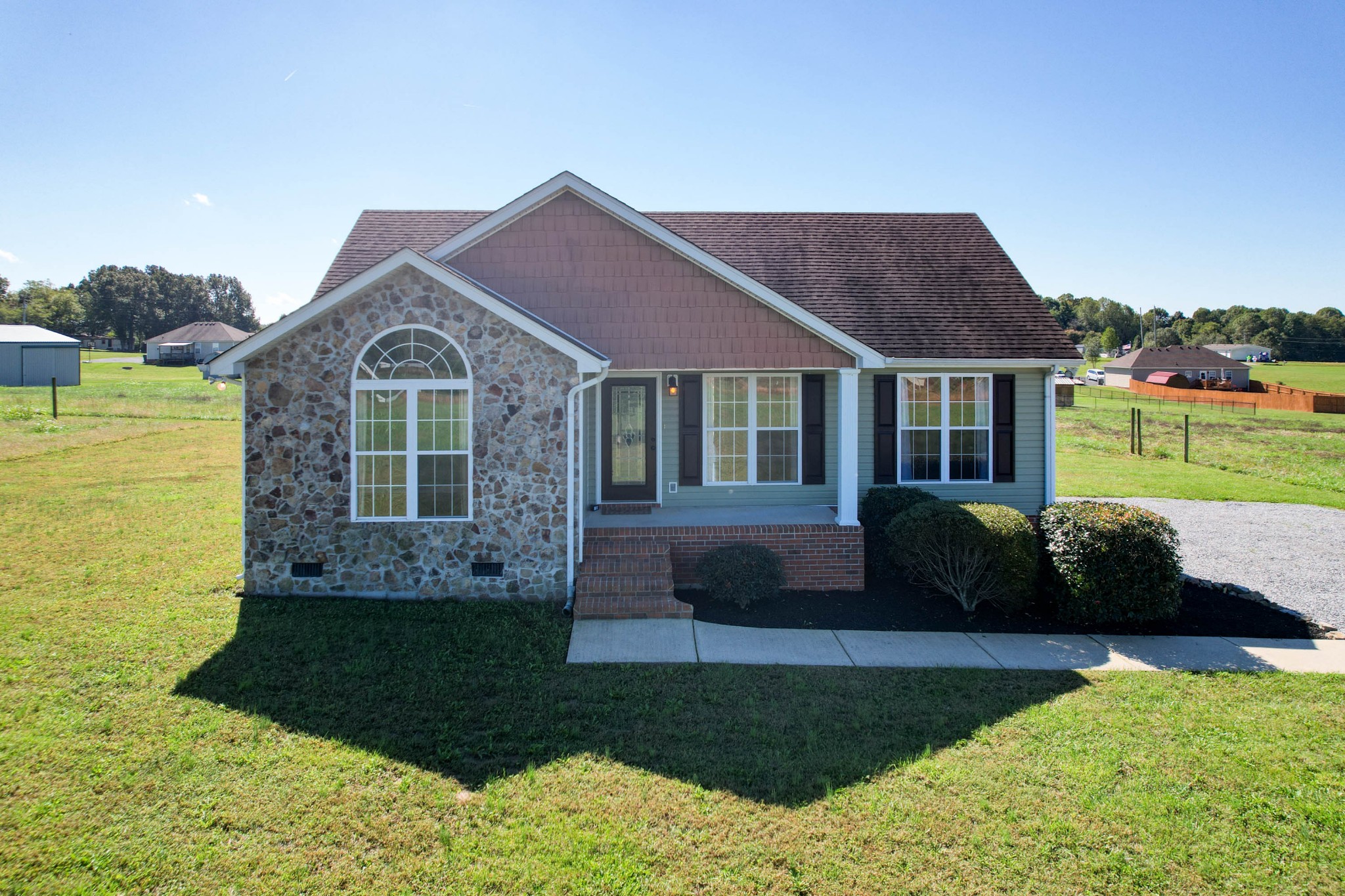 724 Lear Road Portland, TN 37148 - Photo 3 of 32 a front view of a house with a garden