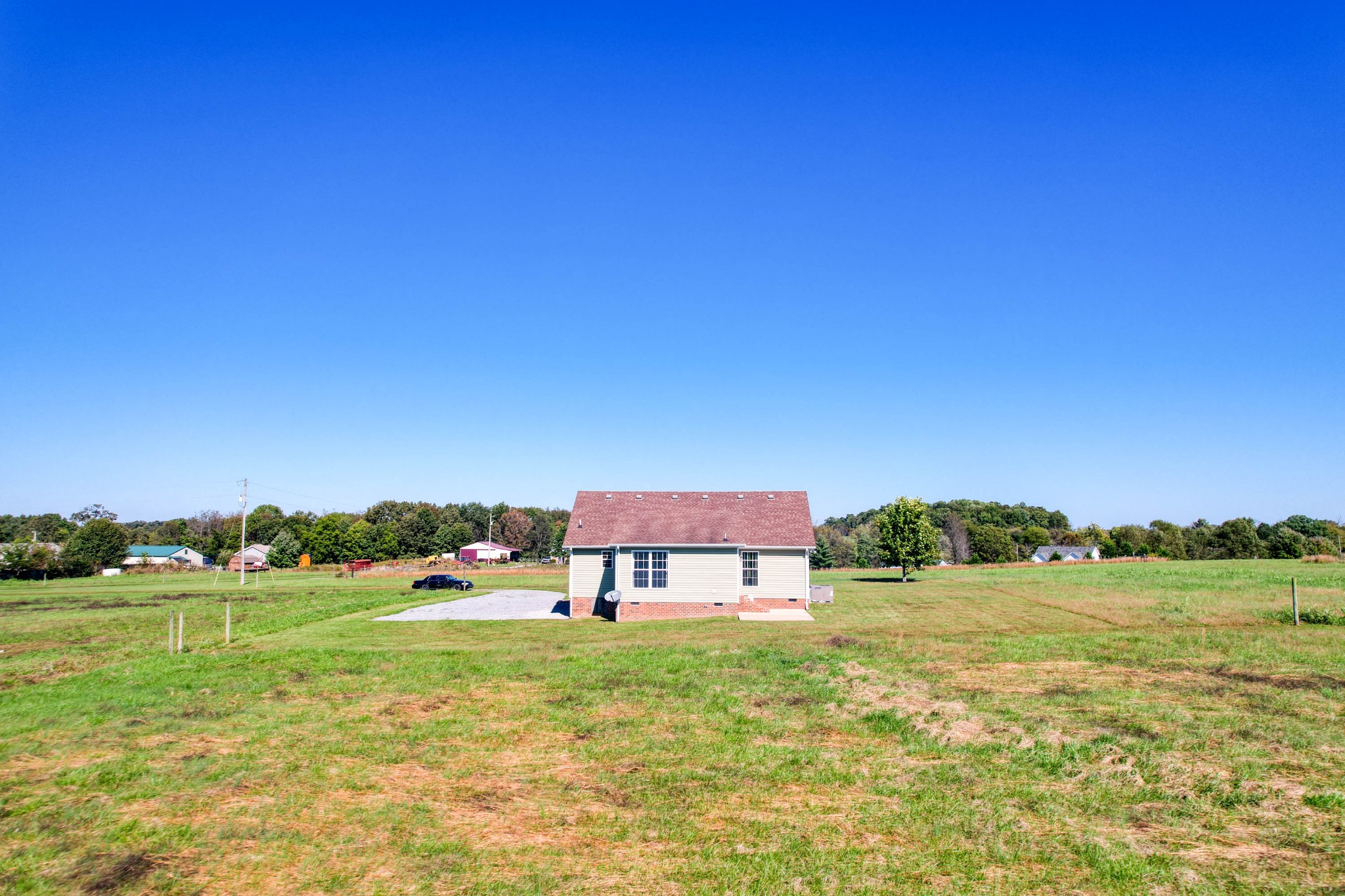724 Lear Road Portland, TN 37148 - Photo 24 of 32 a view of a big yard with swimming pool and an outdoor seating