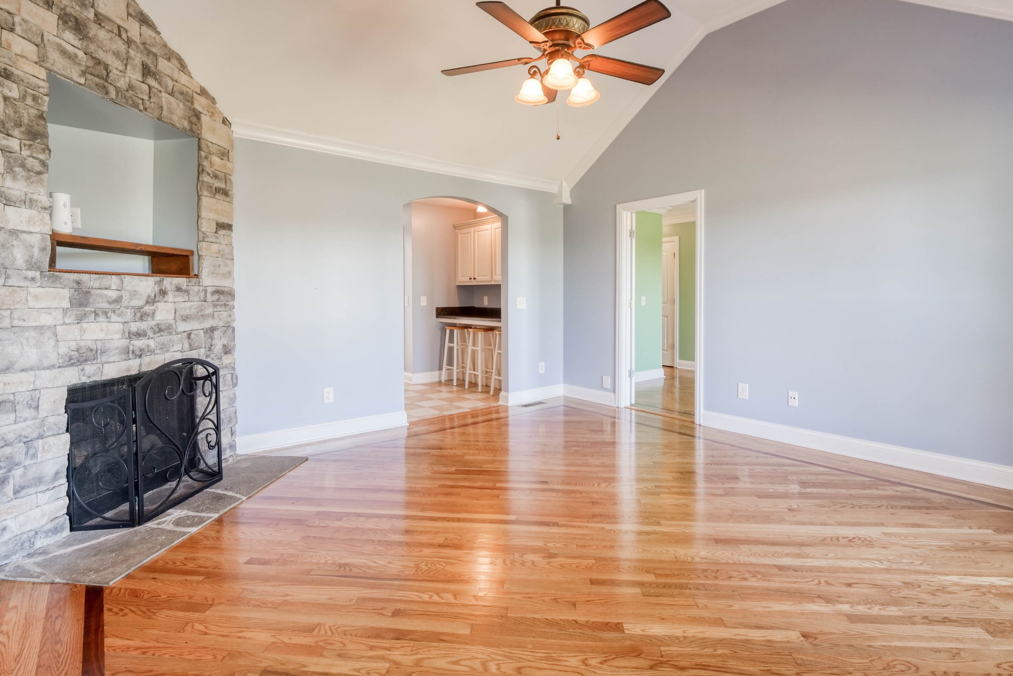 724 Lear Road Portland, TN 37148 - Photo 5 of 32 a view of a livingroom with wooden floor and a fireplace