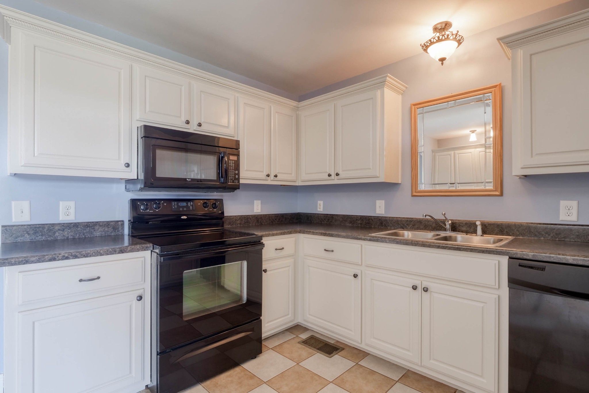 724 Lear Road Portland, TN 37148 - Photo 10 of 32 a kitchen with granite countertop white cabinets white stainless steel appliances and a sink