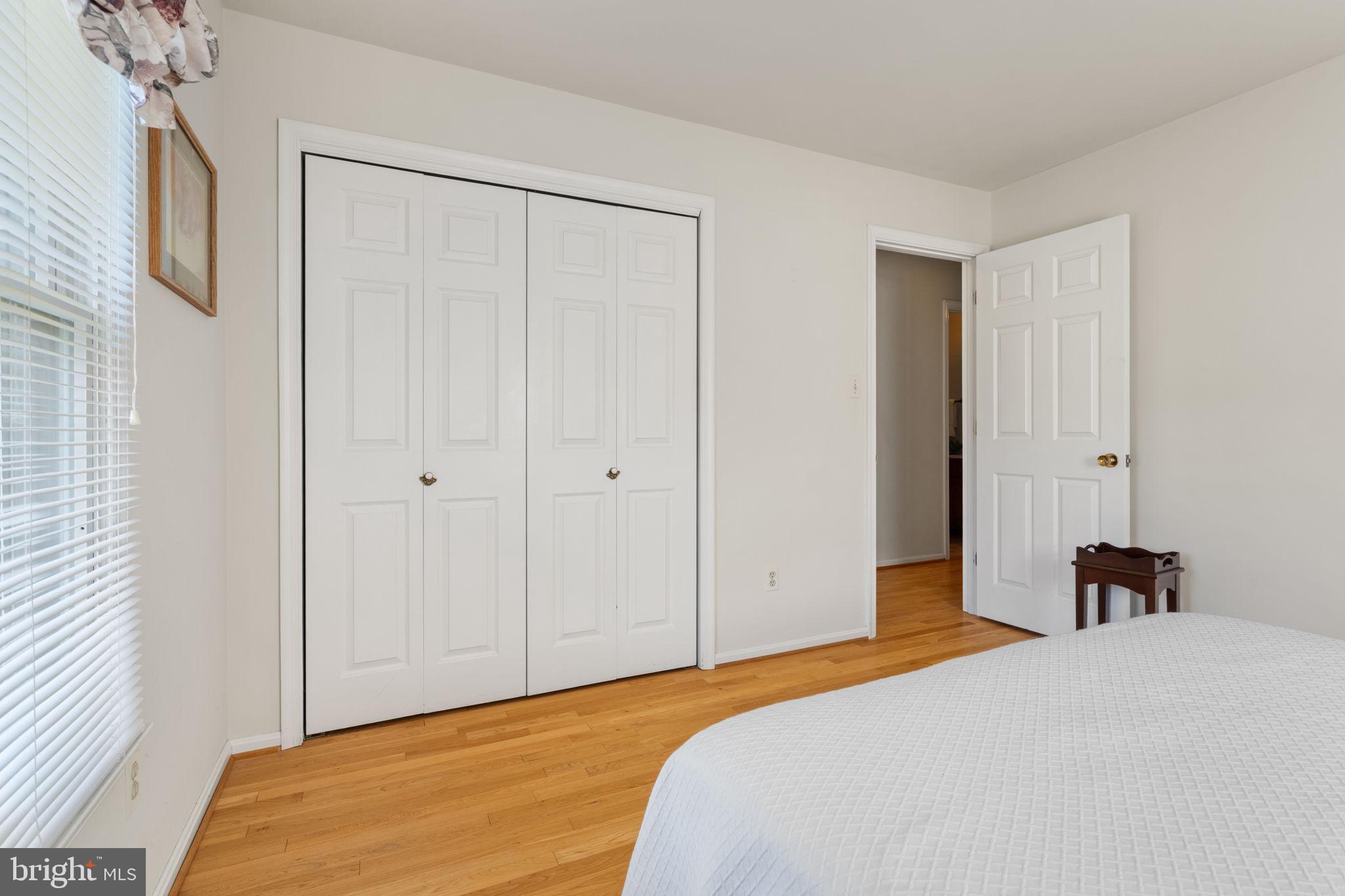 161 Troy Road Louisa, VA 23093 - Photo 24 of 60 a bedroom with a bed and a chandelier
