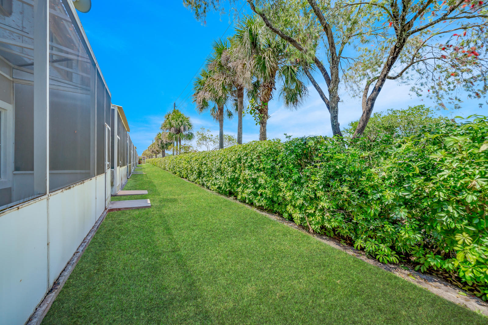 8313 Vía Serena Boca Raton, FL 33433 - Photo 52 of 78 Grassy area behind patio