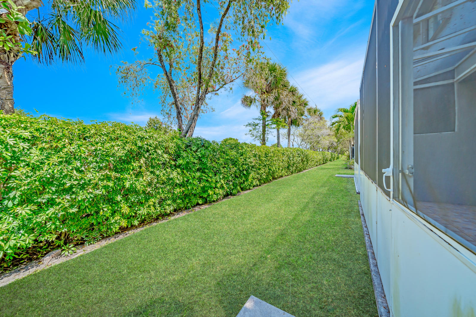 8313 Vía Serena Boca Raton, FL 33433 - Photo 53 of 78 Grassy area behind patio