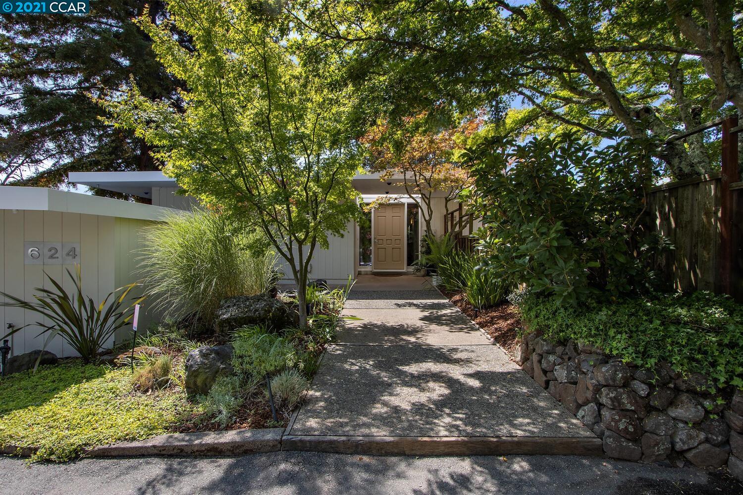 a backyard of a house with lots of green space