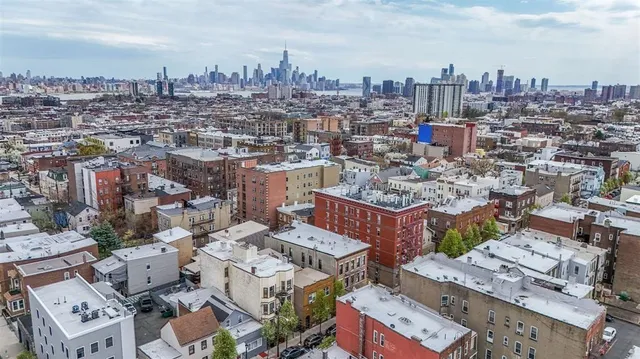 an aerial view of a city with lots of residential buildings