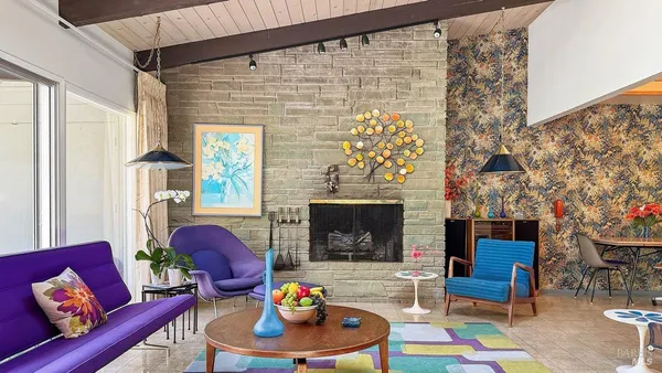 a dining room with furniture water view and a fireplace