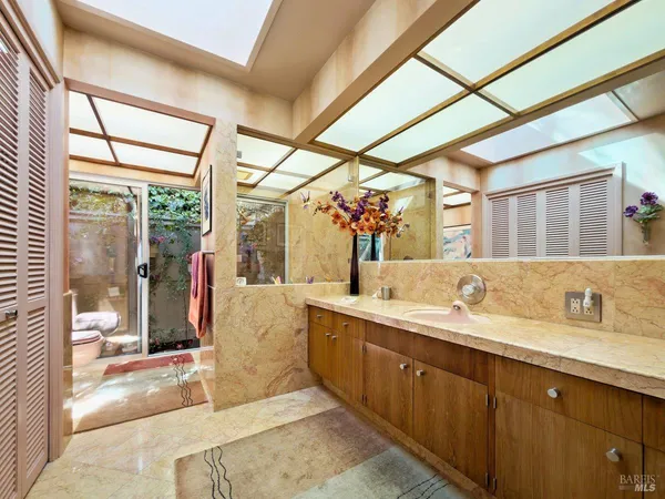a bathroom with a double vanity sink mirror and double