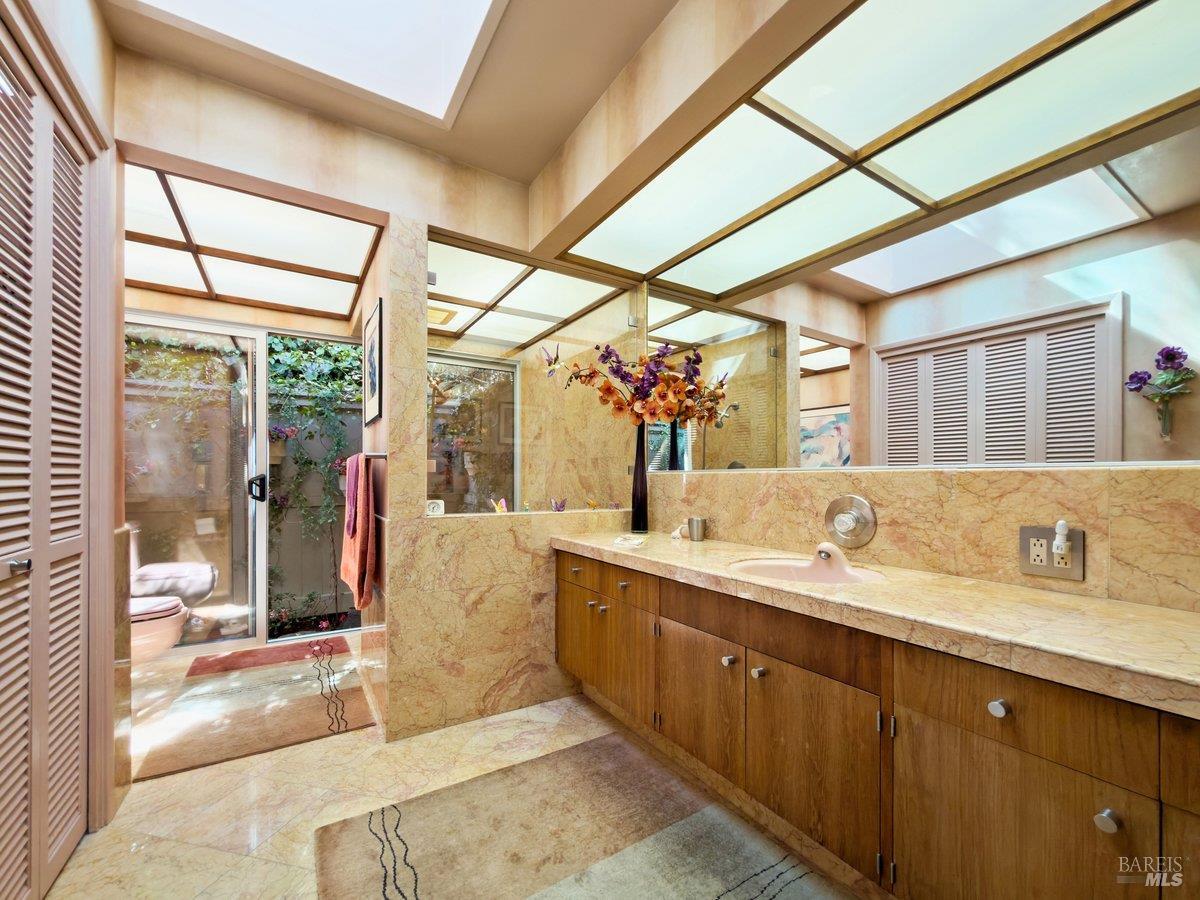 5 Mather Road San Anselmo, CA 94960 - Photo 19 of 58 a spacious bathroom with a granite countertop sink mirror and shower