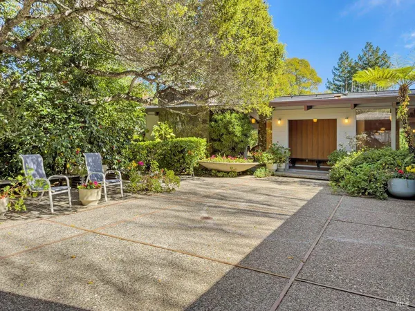 a view of a house with outdoor space and porch