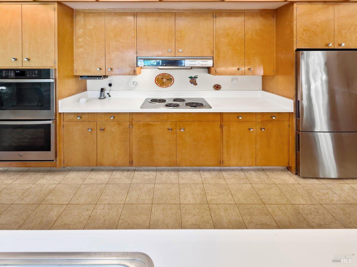 5 Mather Road San Anselmo, CA 94960 - Photo 22 of 58 a bathroom with a sink a mirror and a shower