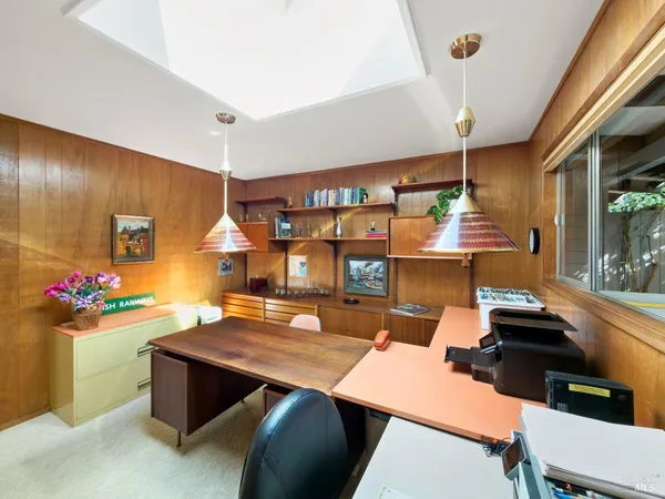 a bedroom with a bed and a table in it
