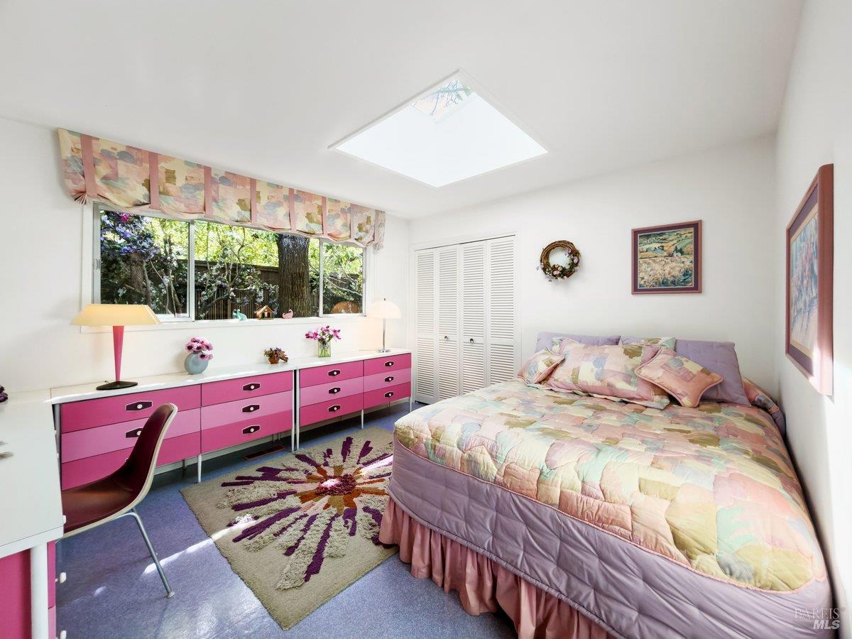 5 Mather Road San Anselmo, CA 94960 - Photo 28 of 58 a bedroom with a bed and wooden floor