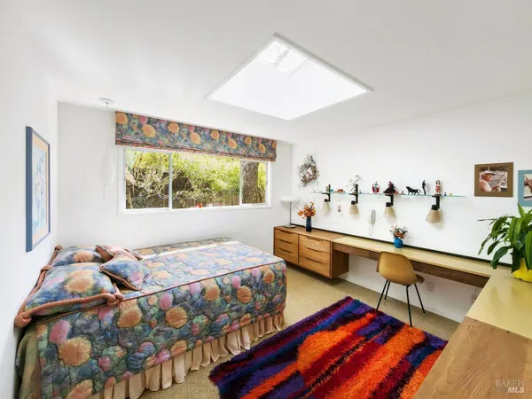 a room with furniture and a large window
