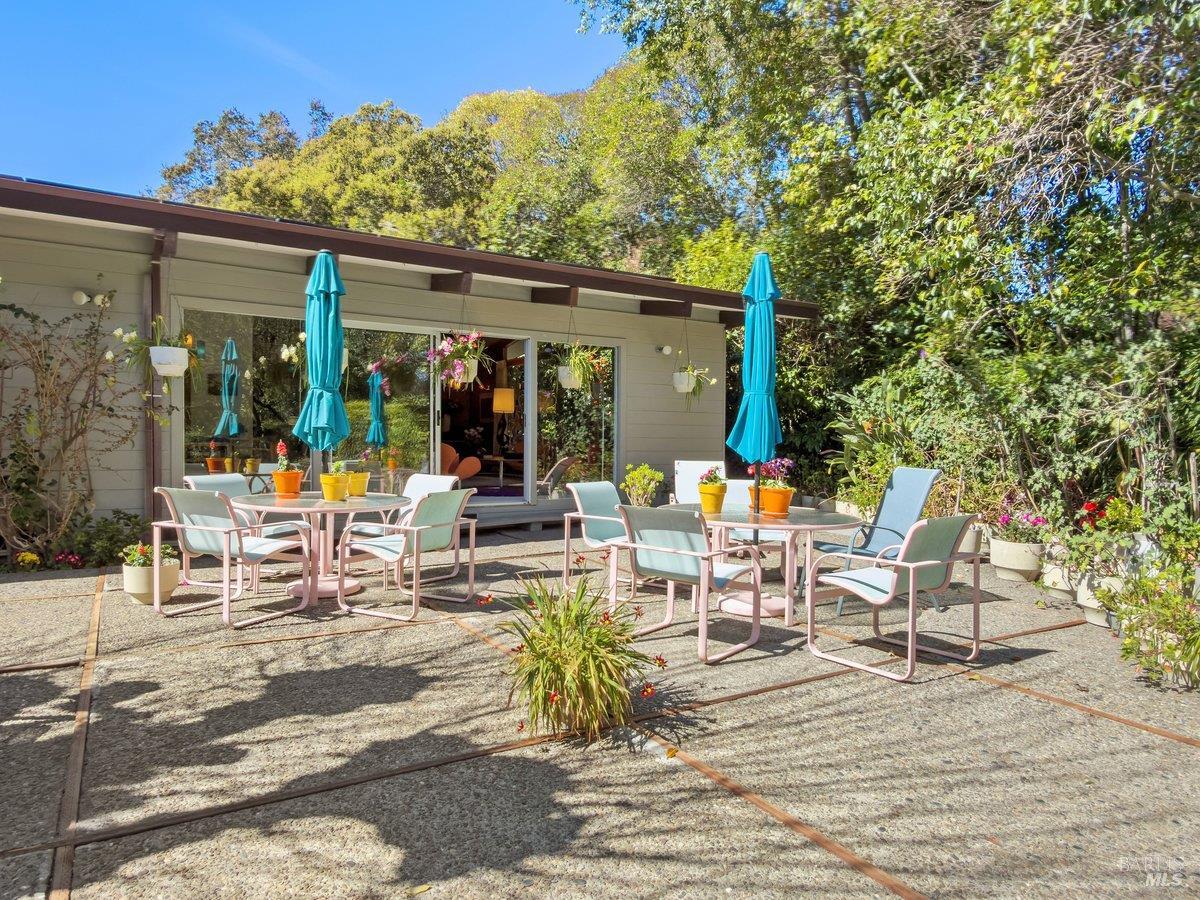 5 Mather Road San Anselmo, CA 94960 - Photo 40 of 58 a view of the patio with dining table and chairs with wooden floor and fence