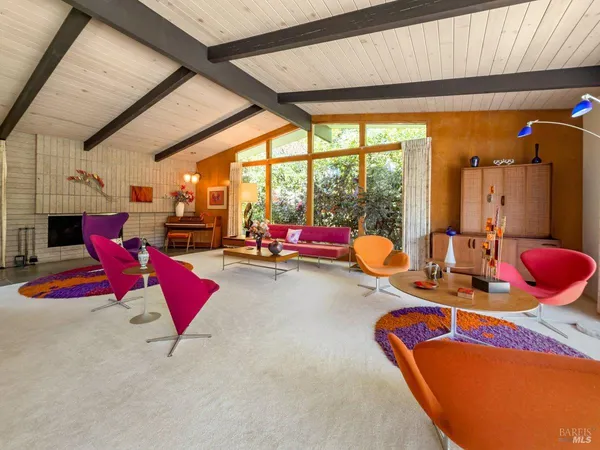 a room with furniture and a large window