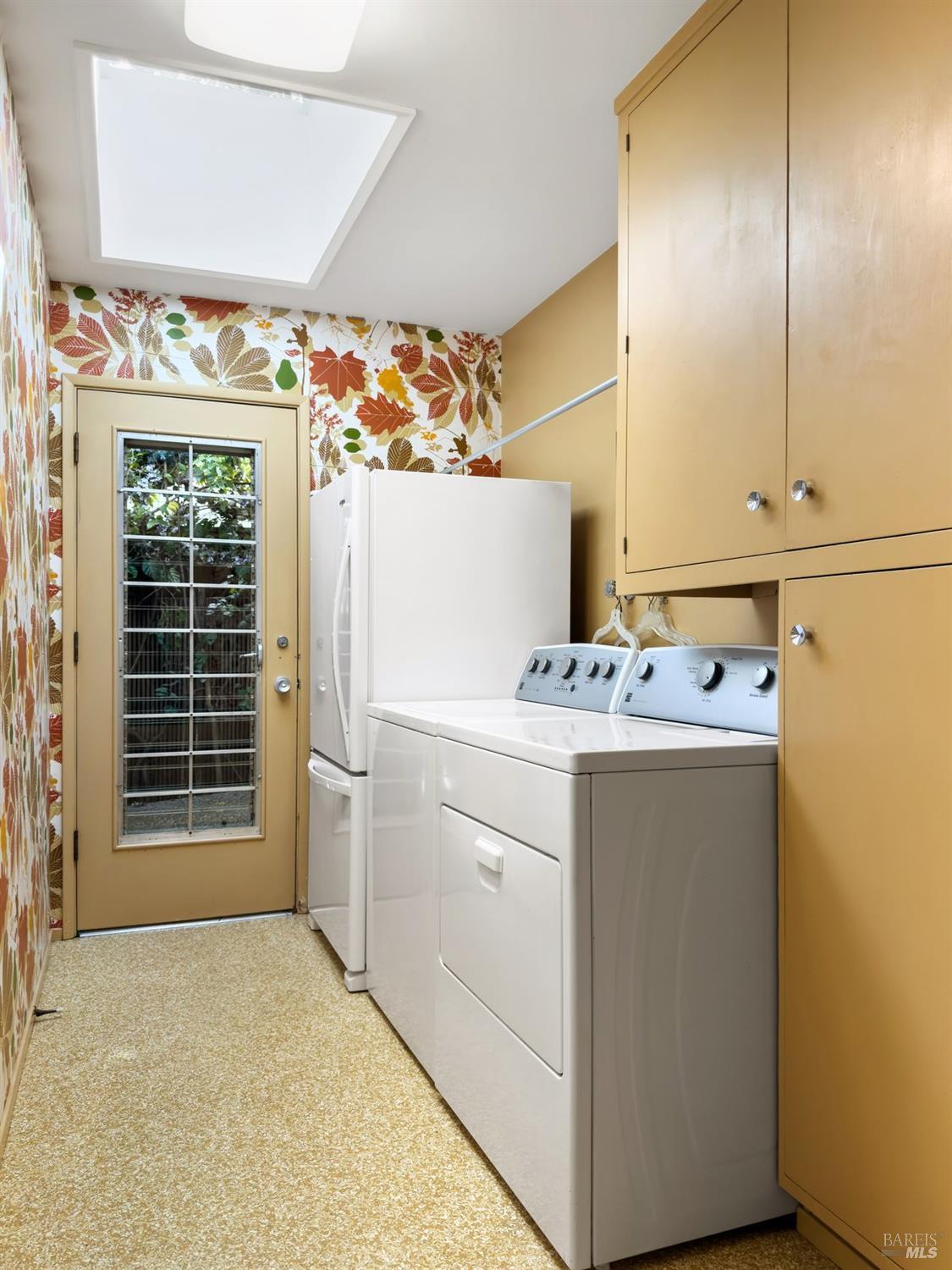 5 Mather Road San Anselmo, CA 94960 - Photo 52 of 58 a utility room with cabinets washer and dryer