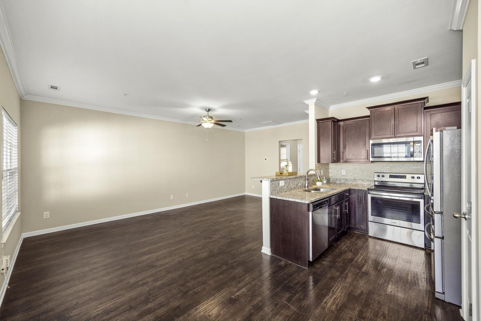 112 Bergen Drive Spring Hill, TN 37174 - Photo 15 of 37 a kitchen with stainless steel appliances granite countertop a stove and a refrigerator