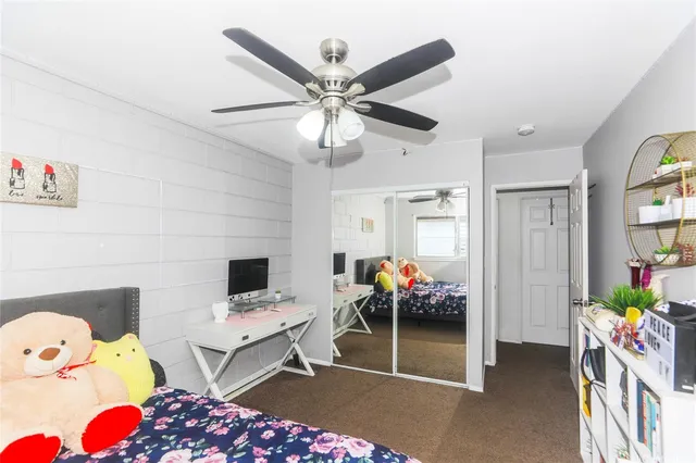 a bedroom with furniture and flat screen tv