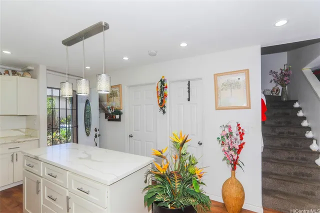 a bathroom with a sink a vanity and a shower