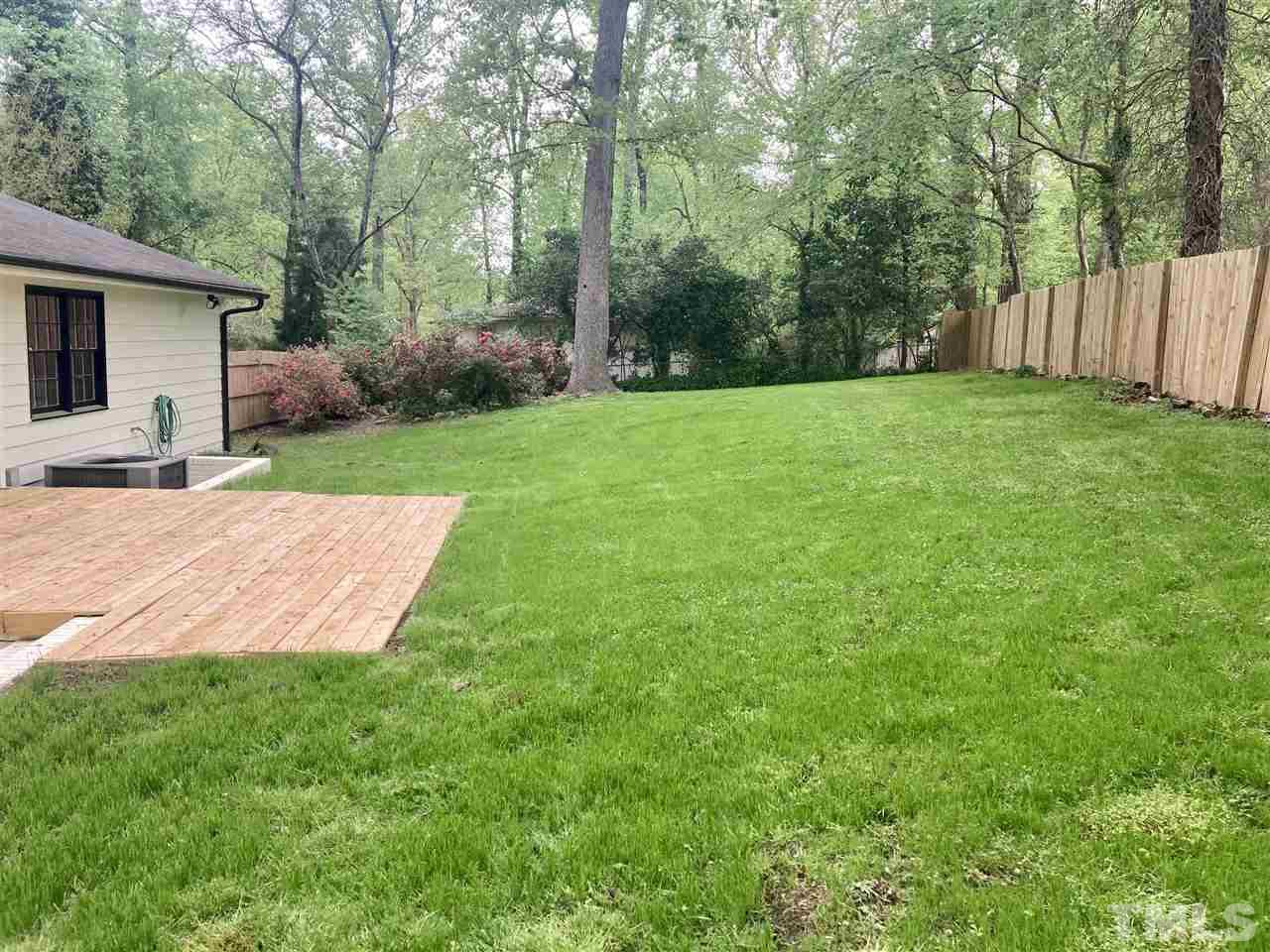 6408 Johnsdale Road Raleigh, NC 27615 - Photo 19 of 29 a view of a backyard with a garden