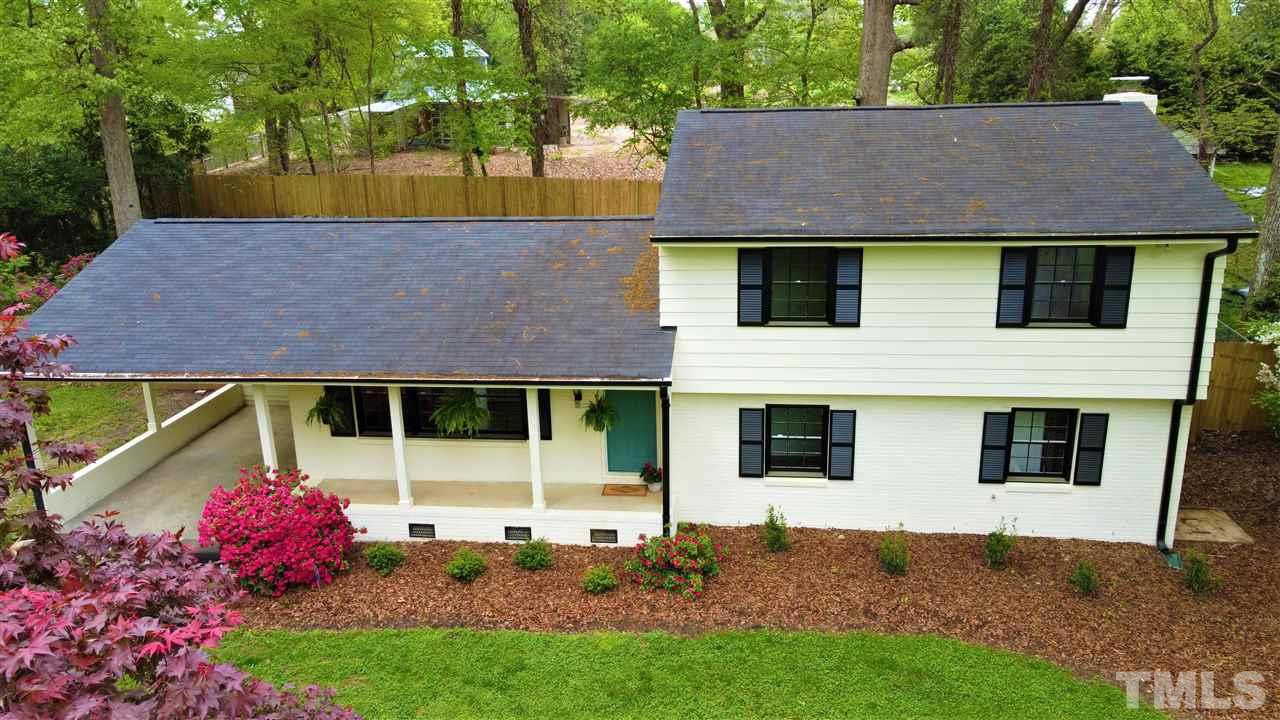 6408 Johnsdale Road Raleigh, NC 27615 - Photo 24 of 29 a view of house with backyard and garden
