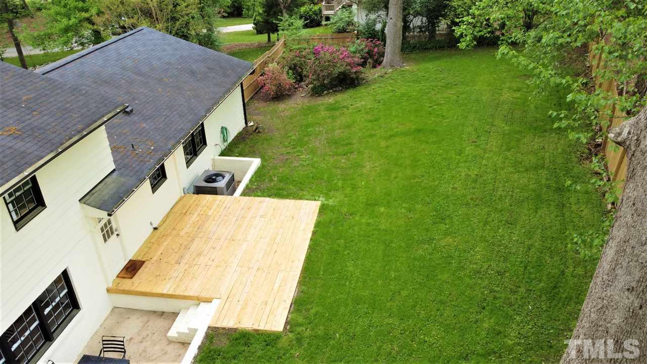 6408 Johnsdale Road Raleigh, NC 27615 - Photo 25 of 29 a view of an house with backyard