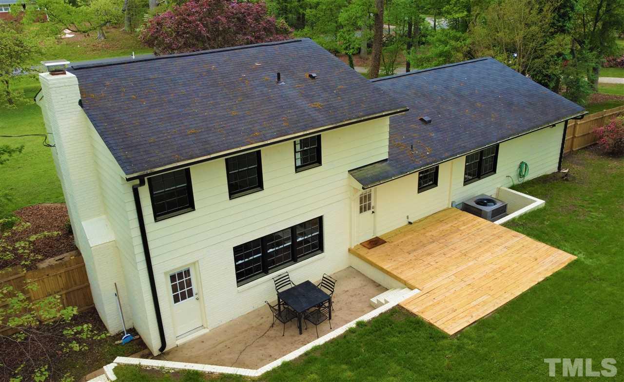 6408 Johnsdale Road Raleigh, NC 27615 - Photo 26 of 29 a aerial view of a house with a yard