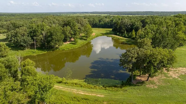 a view of a lake with a yard