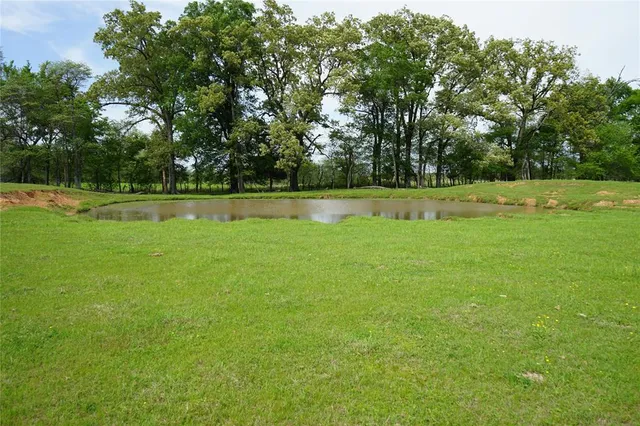 a view of outdoor space with a lake view