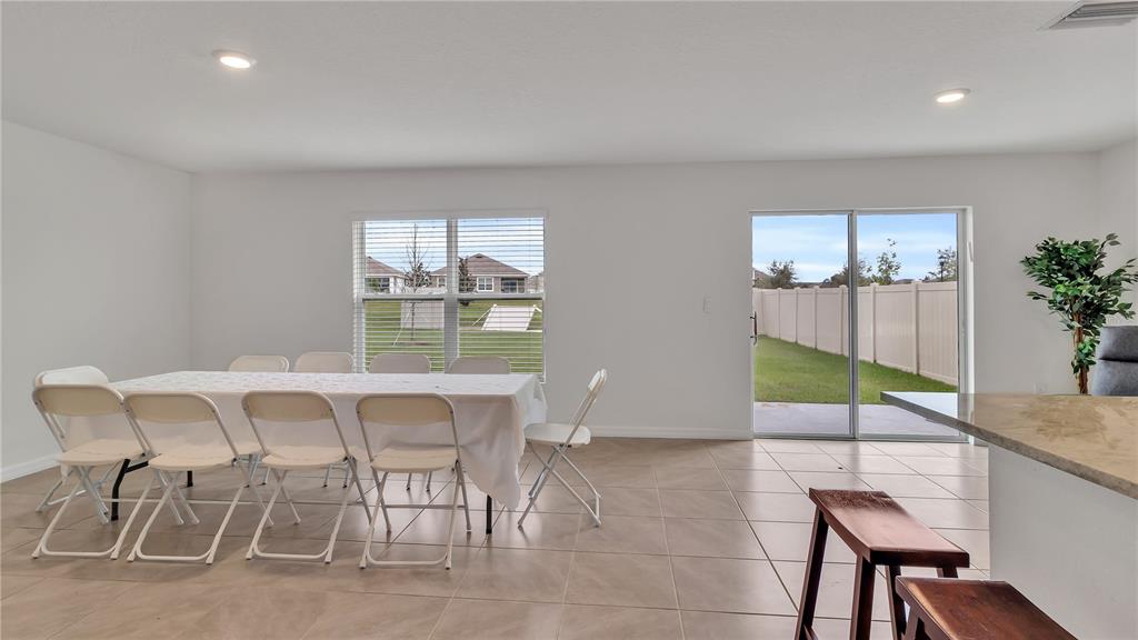 16614 Windmill Forge Pass Wimauma, FL 33598 - Photo 18 of 18 a dining room with furniture and window