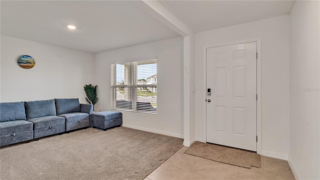 16614 Windmill Forge Pass Wimauma, FL 33598 - Photo 6 of 18 a living room with furniture and a window