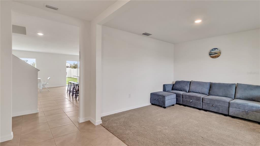 16614 Windmill Forge Pass Wimauma, FL 33598 - Photo 7 of 18 a living room with furniture and a couch