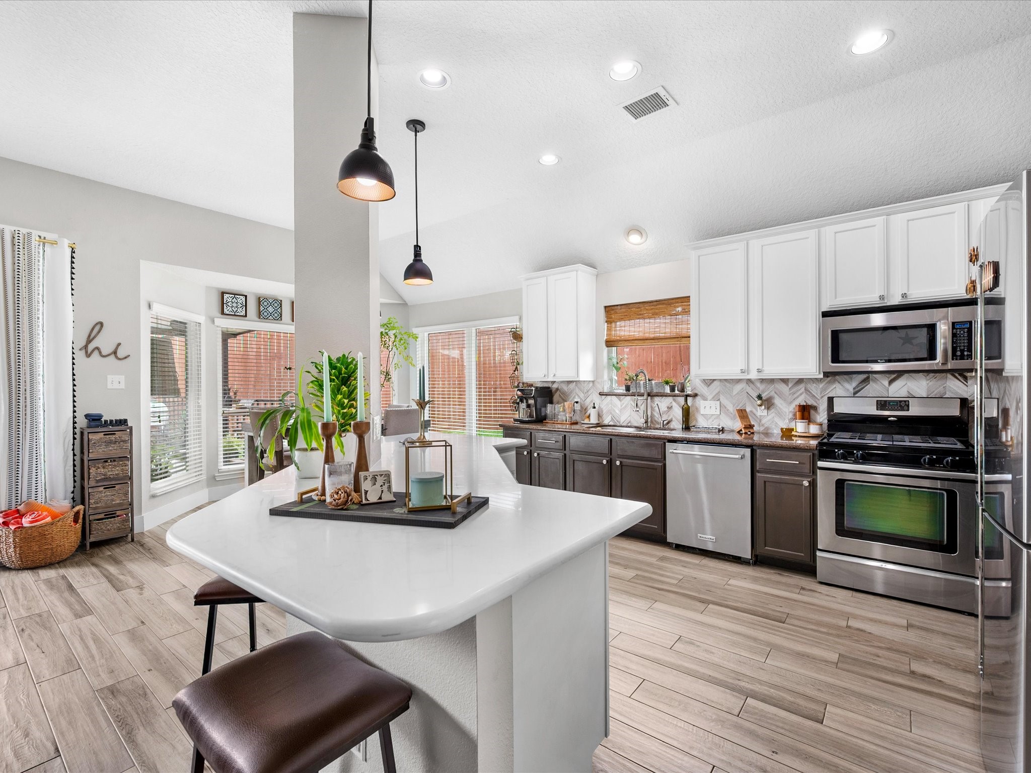 4023 Tigris Ridge Drive Katy, TX 77449 - Photo 12 of 39 The kitchen is the heart of the home, featuring sleek finishes, an expansive island, and effortless flow into the main living areas.
