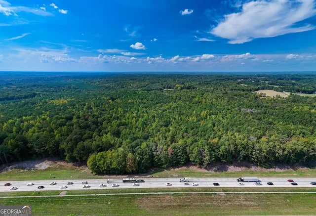 a view of swimming pool with a yard