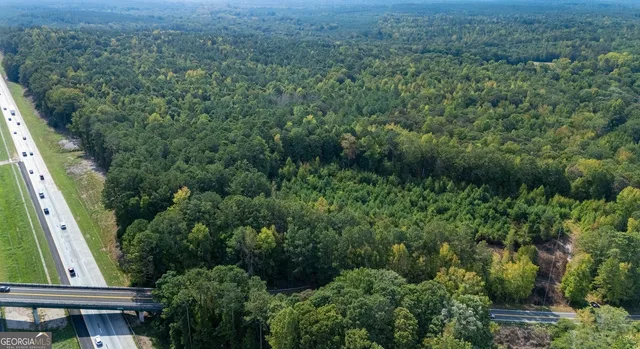 an aerial view of residential house with outdoor space