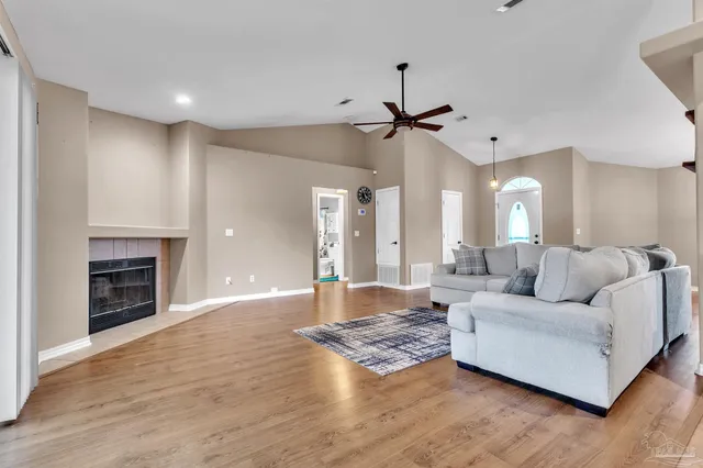 a living room with furniture or fireplace and a wooden floor