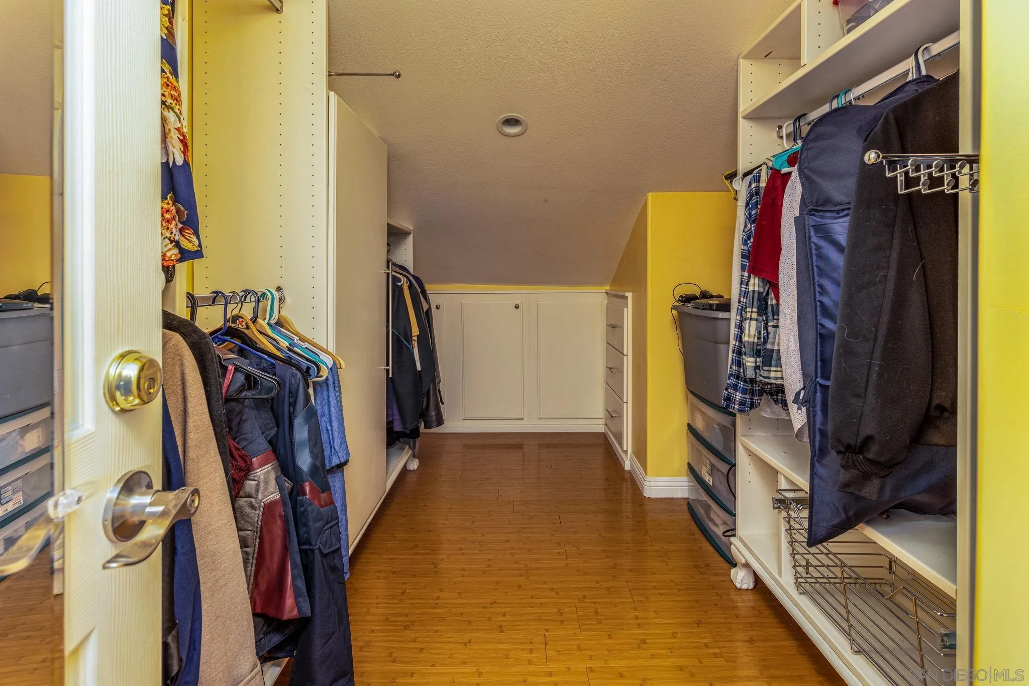 532 Kempton Street Spring Valley, CA 91977 - Photo 22 of 30 a view of walk in closet with clothes and shoes