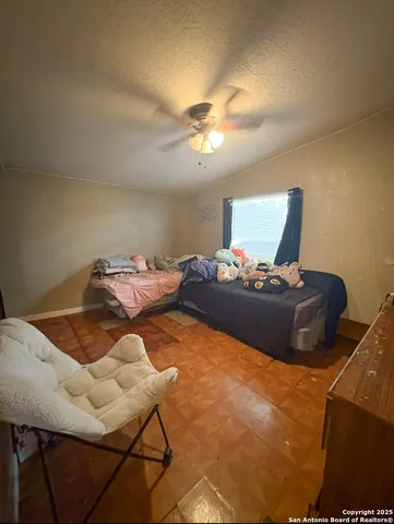 a bedroom with a bed and chair