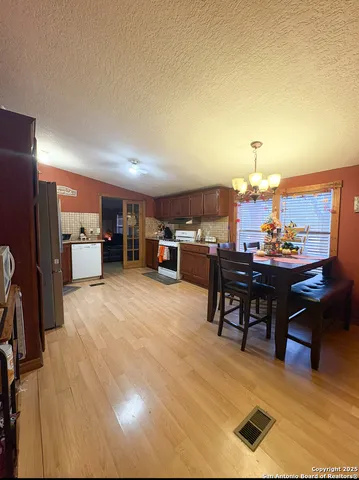 a view of a dining room with furniture