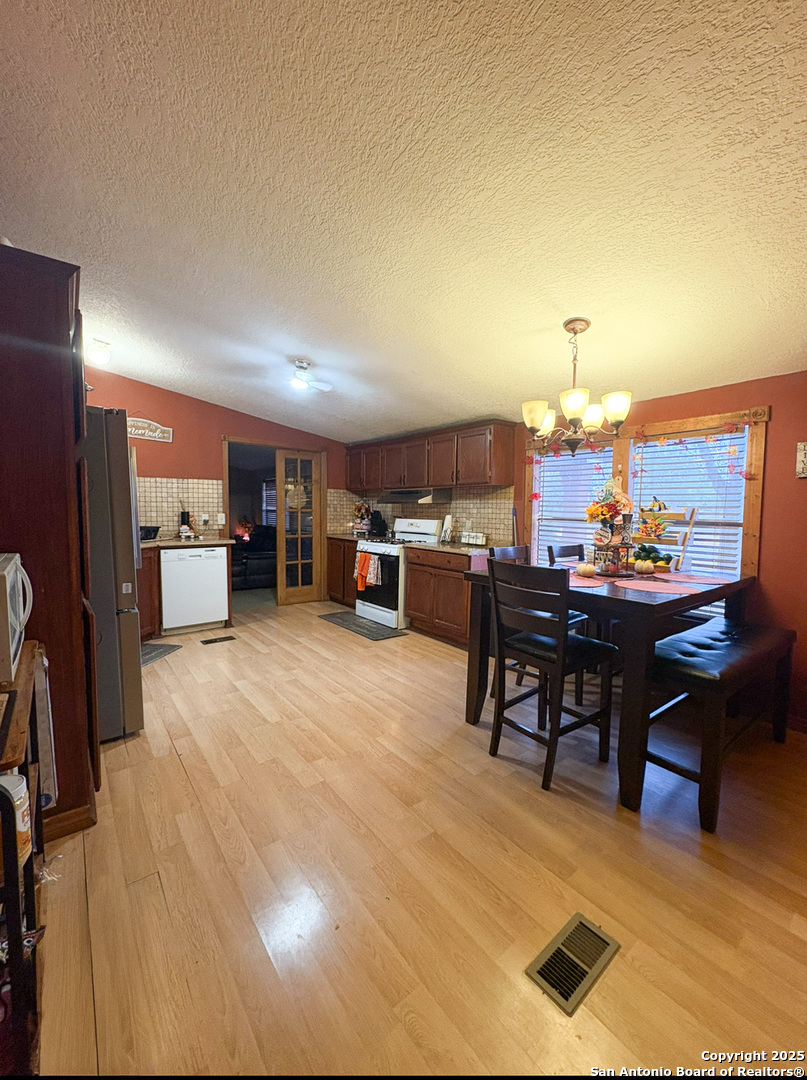42 Mobile Road Cotulla, TX 78014 - Photo 15 of 21 a view of a dining room with furniture
