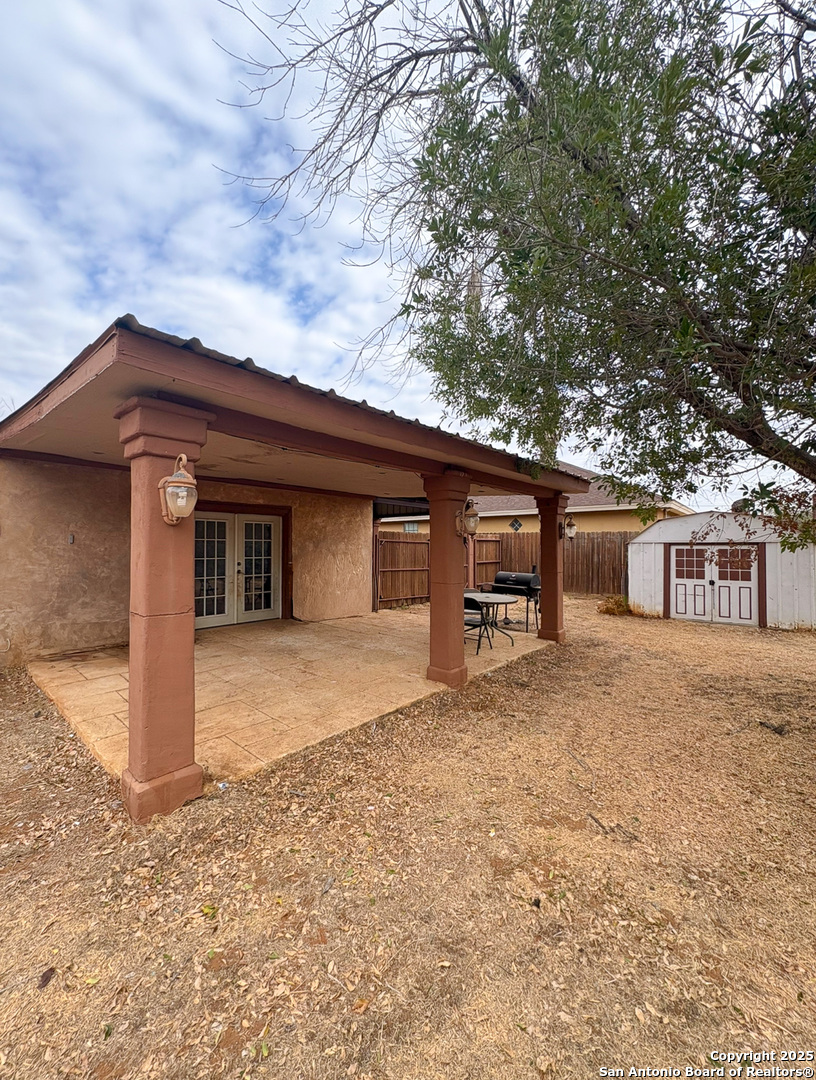 42 Mobile Road Cotulla, TX 78014 - Photo 20 of 21 a house with trees in front of it